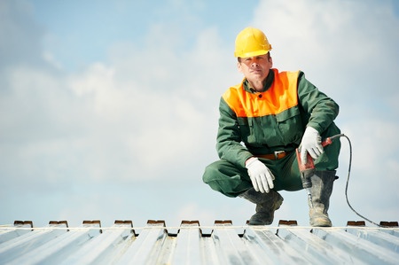 metal roofer on top of roof