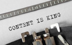 Document in typewriter that reads "Content is King"