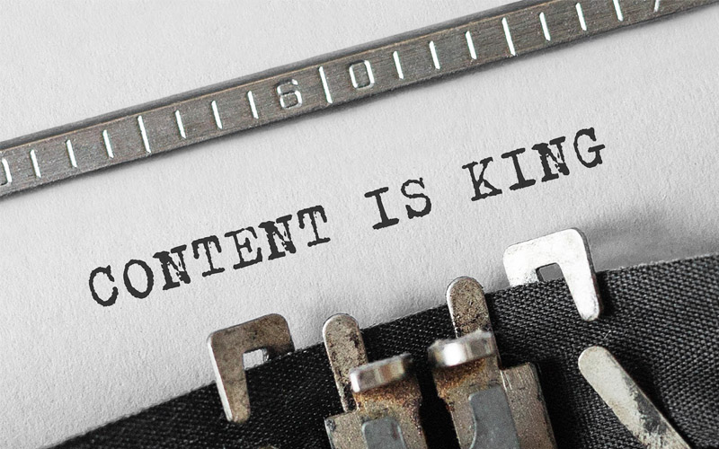 Document in typewriter that reads "Content is King" Document in typewriter that reads "Content is King"